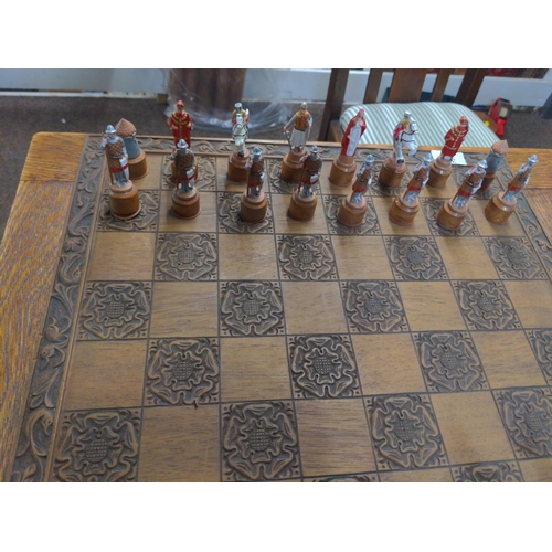 322 - Crusaders v Saracens lead figure chess pieces with wooden chess board W 46 CM