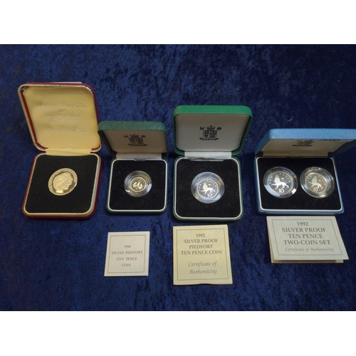 330 - Four boxed silver coins, including: Royal Mint 1992 ten pence two-coin set with certificate; Royal M... 