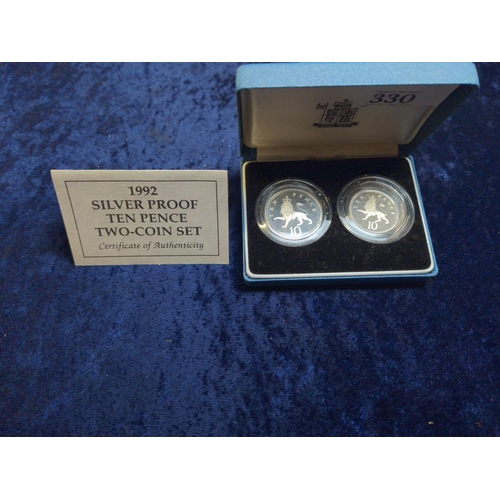 330 - Four boxed silver coins, including: Royal Mint 1992 ten pence two-coin set with certificate; Royal M... 