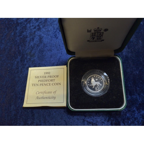 330 - Four boxed silver coins, including: Royal Mint 1992 ten pence two-coin set with certificate; Royal M... 