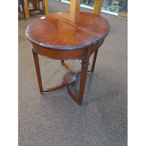 624 - Mahogany occasional table oval in shape with four stylish legs and attractive cross member to base o... 