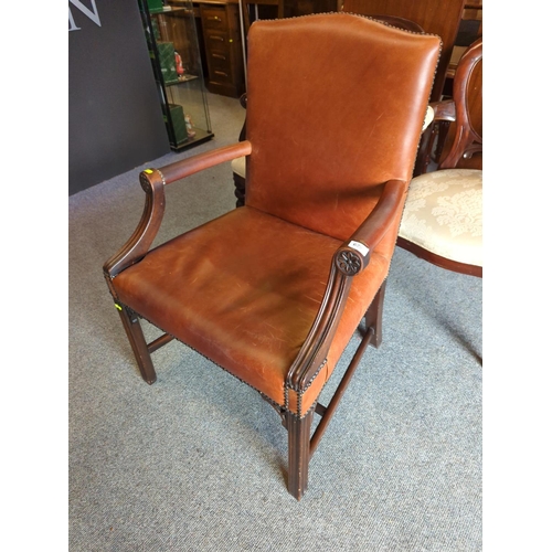 625 - Large leather upholstered arm/elbow chair with studded finish to edging.