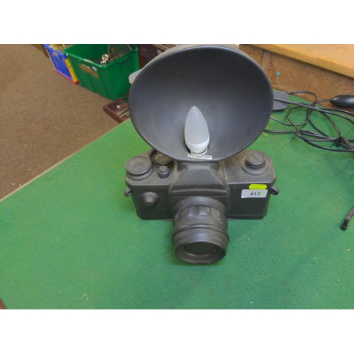 480 - Two novelty lamps, modelled as a camera & a spotlight respectively, ceramic camera light 31cm hi... 