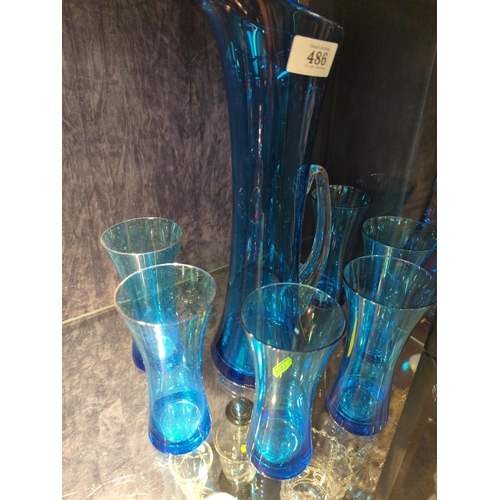 621 - Hand blown kingfisher blue glass elegant jug (35.5cm height) and six glass set. Thought to be Whitef... 