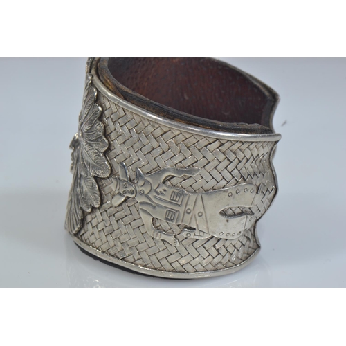 414 - Native American Navajo white metal cuff, the front with applied native American chief flanked by a n... 