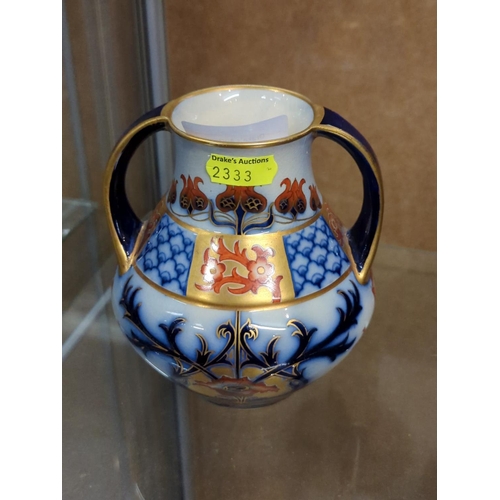 592 - Macintyre twin handled vase with blue, gilt and orange floral decoration and Buslem mark, Rd. No. 31... 