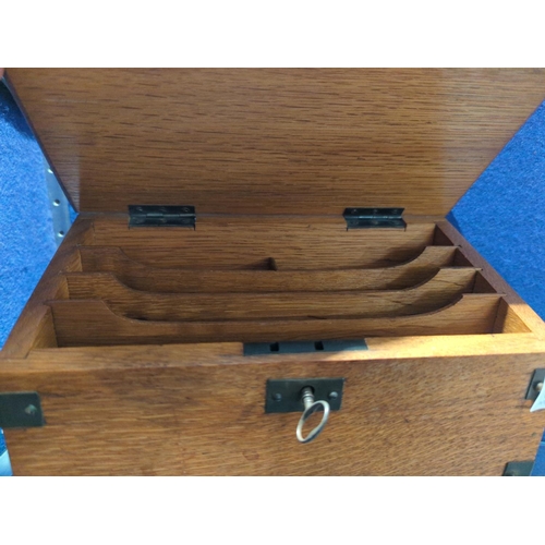 603 - Arts & Crafts oak stationary box with key. 25cm long x 12cm deep x 19cm high