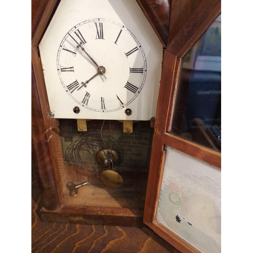 610 - Ecclesiastical style mantle clock. With a reverse transfer beehive panel. With pendulum & key