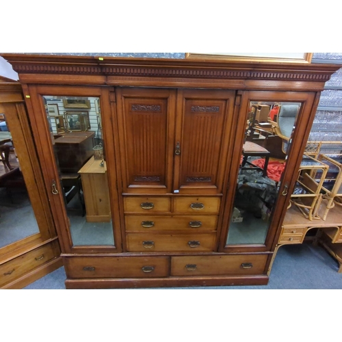 654 - Early C20 large compactum wardrobe, with 2 mirror fronted doors flanking central unit comprised of 2... 