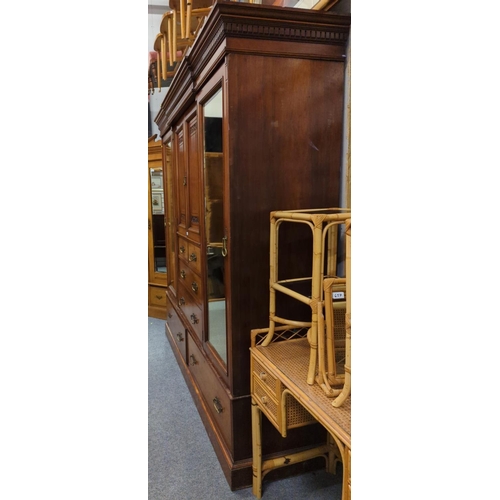 654 - Early C20 large compactum wardrobe, with 2 mirror fronted doors flanking central unit comprised of 2... 