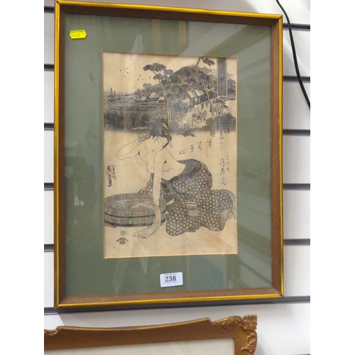 238 - Framed Japanese print of a Geisha bathing. 38cm x 48cm inclusive of frame.