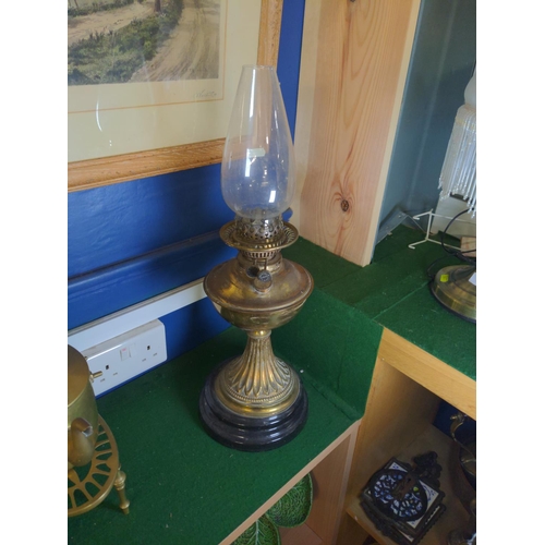 285 - Brass and ceramic base globe oil lamp. H 56 CM