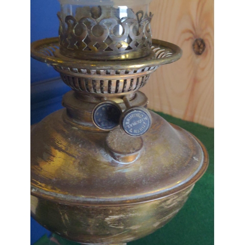 285 - Brass and ceramic base globe oil lamp. H 56 CM