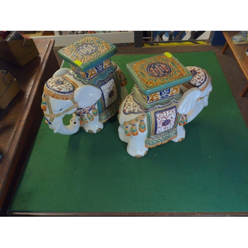 294 - Pair of ceramic elephant plant stands in green blue and white. H 27 L 31 cm approx.