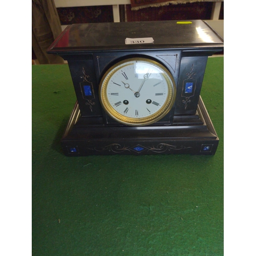330 - French black marble mantle clock with blue inlay and ceramic dial, pendulum operated. Key wind up .