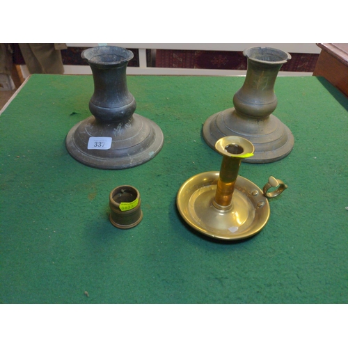 337 - Four brass candle sticks, two large and one night candle stick.