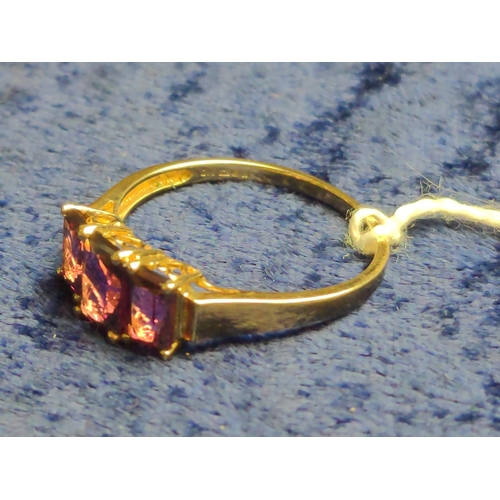 408 - 9ct gold & garnet three stone ring, size T, 2.24 grams