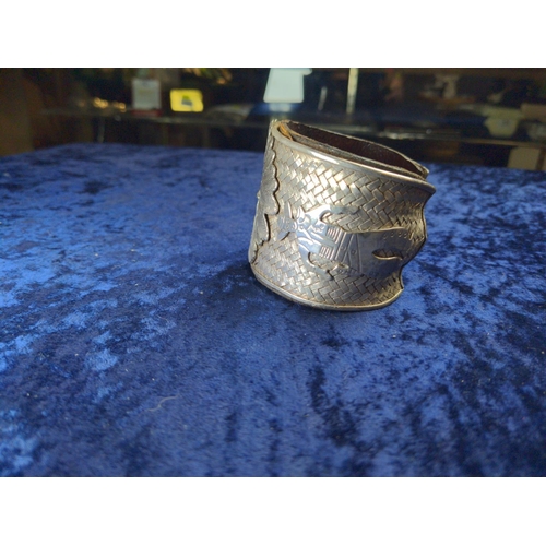 414 - Native American Navajo white metal cuff, the front with applied native American chief flanked by a n... 