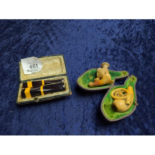 461 - Two figural meerschaum pipes, one with case, together with a cased set of two cheroots