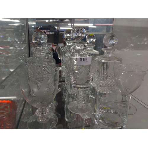 519 - Two shelves of cut glass inc, decanters, jug, and twisted stem glass