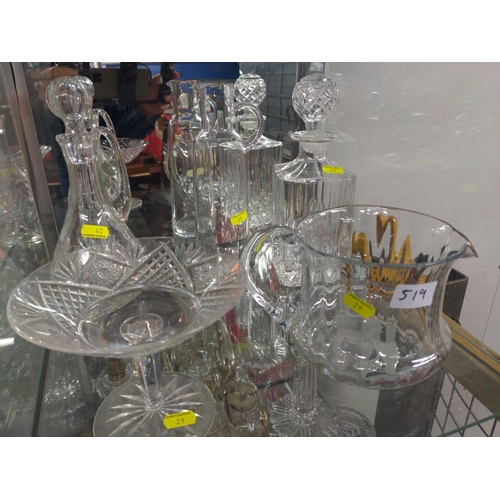 519 - Two shelves of cut glass inc, decanters, jug, and twisted stem glass