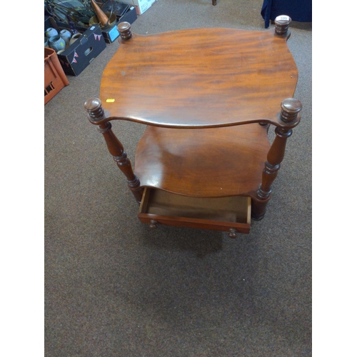 565 - Mahogany two tier occasional table .