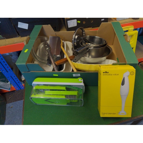 107 - Box of various kitchen items, inc. hand blender (new in box), slicer, knives etc.