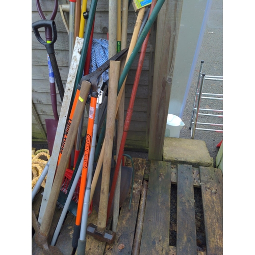 138 - Bundle of long handled gardening tools inc, garden hose , jump leads, clippers, rakes, spades, and s... 