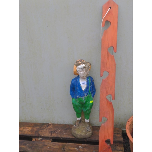 142 - Colourful concrete garden ornament of a farm hand boy plus wooden pot hanging unit. H61cm