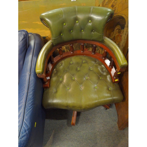 712 - Chesterfield style swivel captains chair.