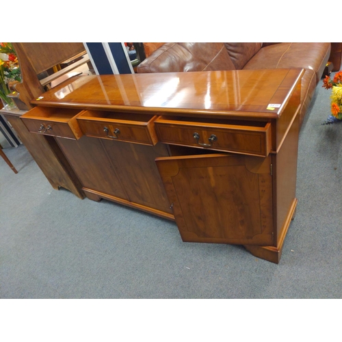 720 - Modern yew veneered sideboard, 3 drawers over 3 cupboards. With 2 keys. 146cm long x 37cm deep x 86c... 