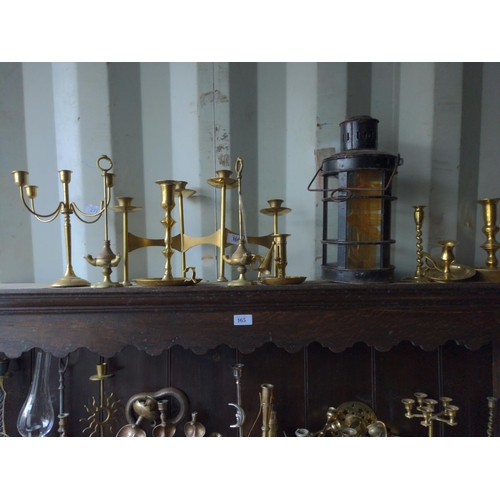 166 - Metal candlesticks over unit