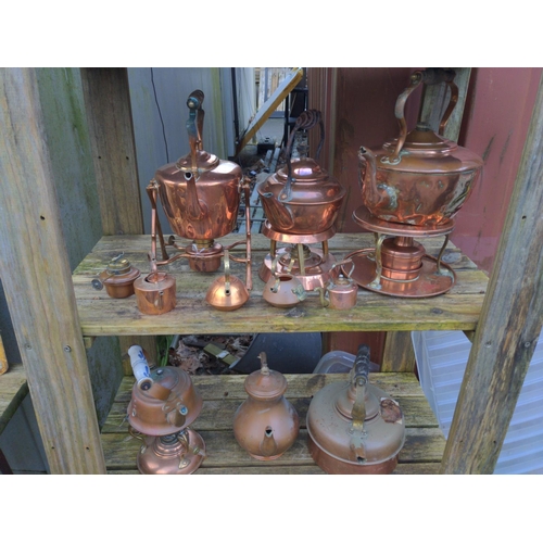 190 - Collection of copper kettles over five shelves