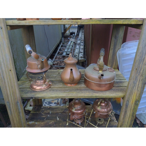 190 - Collection of copper kettles over five shelves