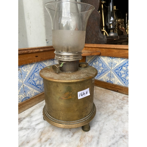 164A - Large and heavy brass based oil lamp. Base appears to be like a military shell case! 