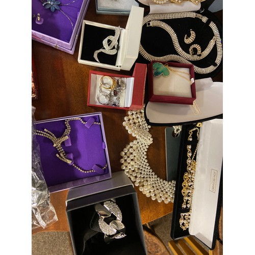 427 - Large quantity of costume jewellery on shelf inc, 2 dress watches. silver earrings, faux pearl colar... 