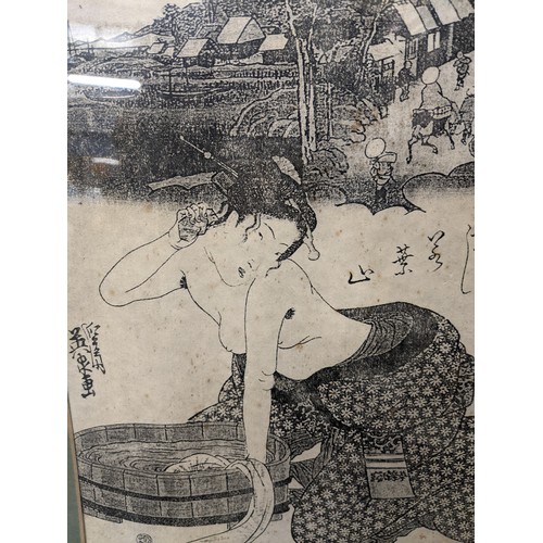 238 - Framed Japanese print of a Geisha bathing. 38cm x 48cm inclusive of frame.