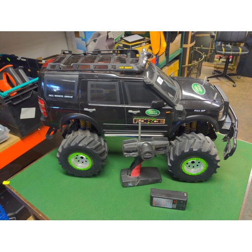 61 - New Bright large land Rover radio controlled vehicle. Does not include charger for batteries, so we ... 