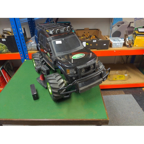 61 - New Bright large land Rover radio controlled vehicle. Does not include charger for batteries, so we ... 