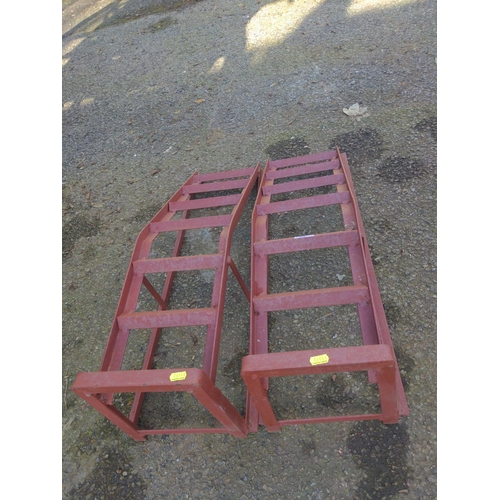 16 - Pair of red painted metal car ramps