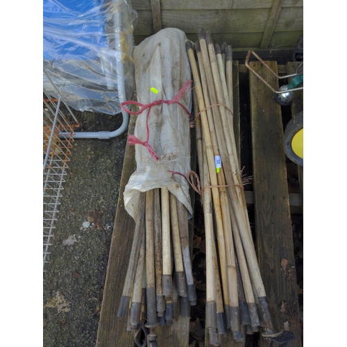 53 - 2 bundles of wooden shaft drain rods