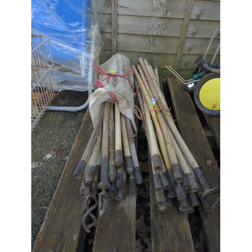 53 - 2 bundles of wooden shaft drain rods