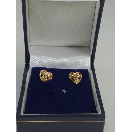 406 - Pair of 9ct gold & diamond heart-shaped ear studs, gross weight 1 gram