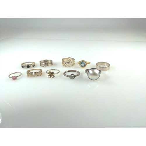 420 - Ten silver rings, including some stone set, gross weight 33 grams