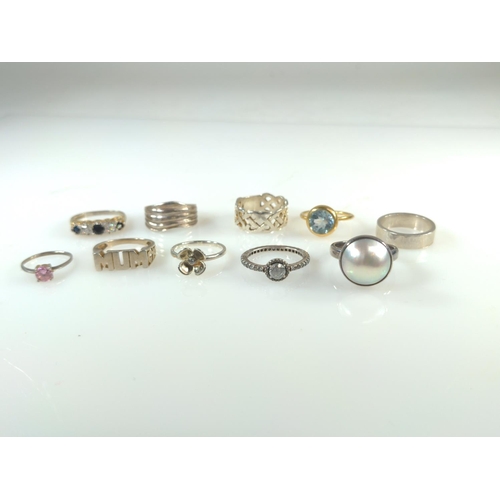 420 - Ten silver rings, including some stone set, gross weight 33 grams