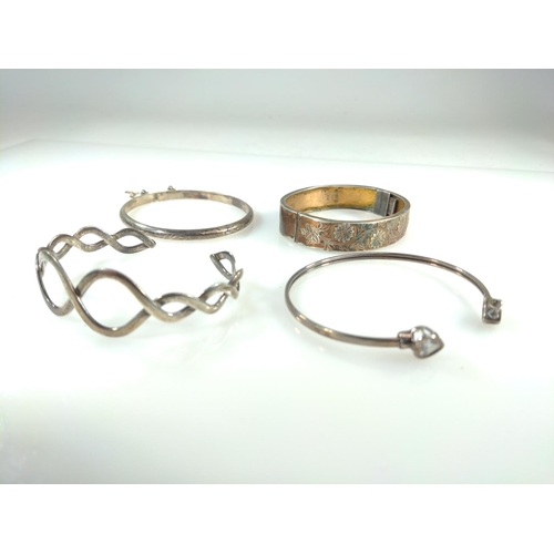 422 - Three silver bracelets & a white metal with white stone terminals cuff, gross weight 41.1 grams