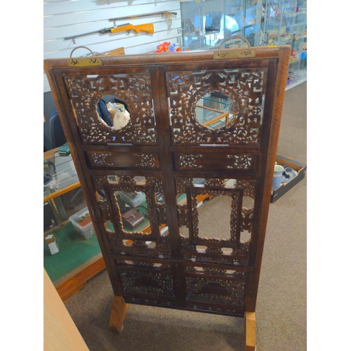 602 - Ornately carved Chinese hardwood screen with panels depicting  figures  154 cms,width 85 cms