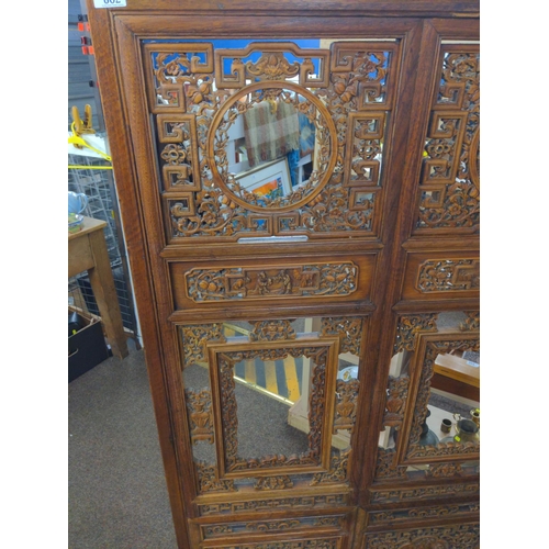 602 - Ornately carved Chinese hardwood screen with panels depicting  figures  154 cms,width 85 cms