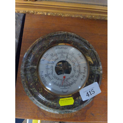 415 - Serpentine mounted barometer, dia. 18cm