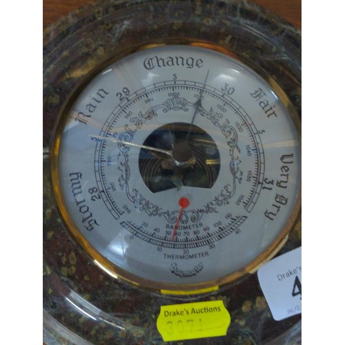 415 - Serpentine mounted barometer, dia. 18cm